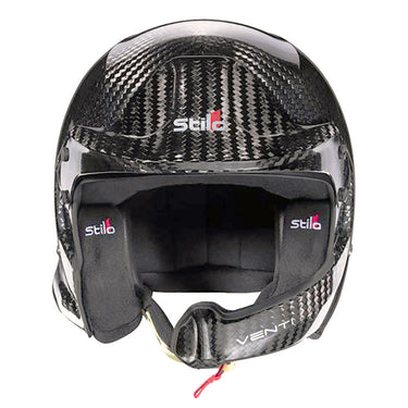 A dynamic shot of the Stilo Venti WRC Carbon Fiber 8860-2018 helmet, highlighting its aerodynamic shape and carbon fiber construction, perfect for professional motorsport.